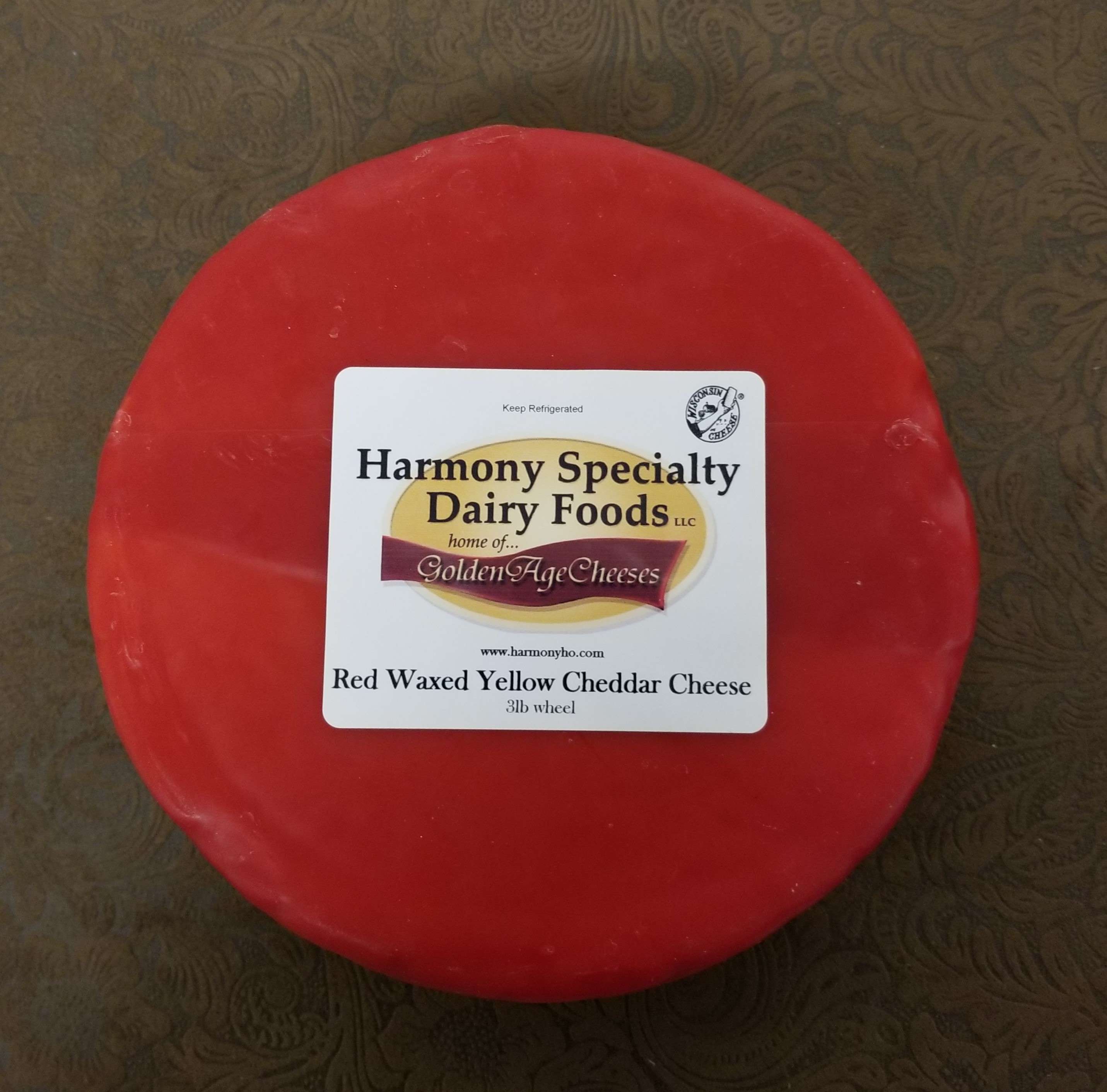 Example of a waxed cheese wheel that can be private labeled